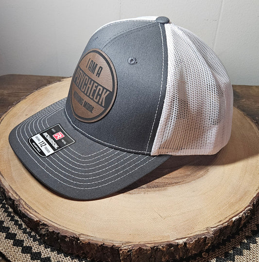 "I Am A Paycheck, Nothing More" trucker cap (charcoal front/white mesh)
