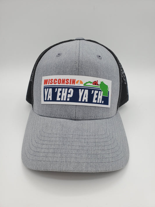 "Ya 'Eh? Ya 'Eh." Wisconsin Plate Design Trucker Hat (Black Mesh/ Heather Grey Fabric)