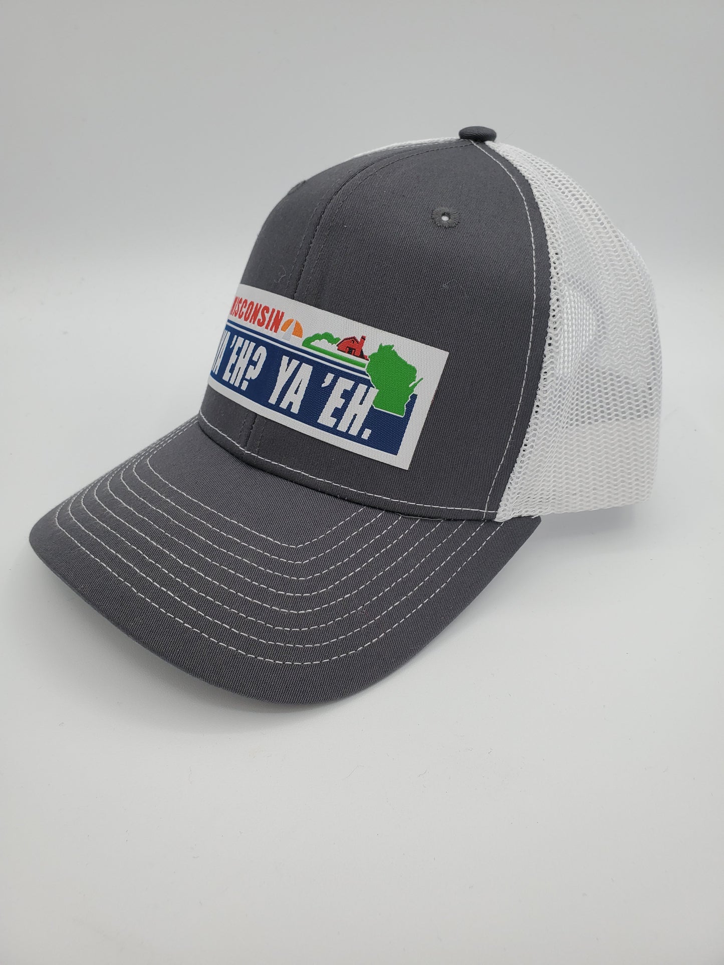 "Ya 'Eh? Ya 'Eh." Wisconsin Plate Design Trucker Hat (White Mesh/ Charcoal Fabric)